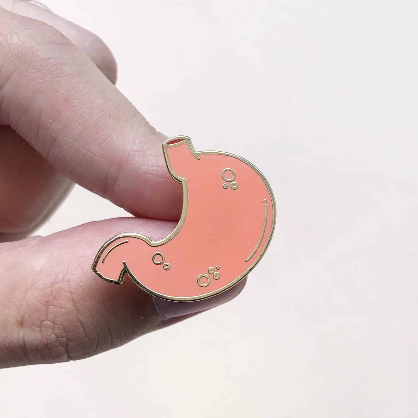 stomach-enamel-pin-hands-pinskills